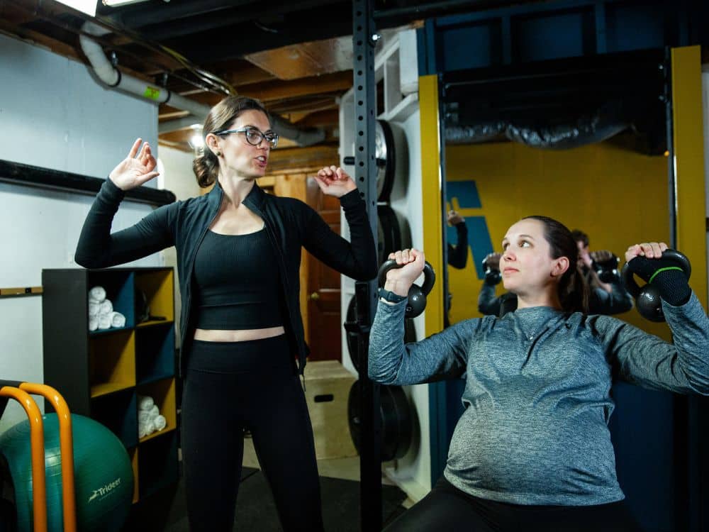 Coach Victoria Parris instructing a member of Parris Performance Institute, LLC
