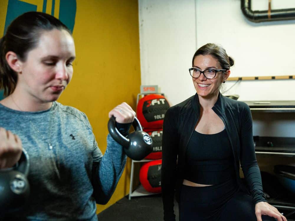 Coach Victoria Parris instructing a member of Parris Performance Institute, LLC