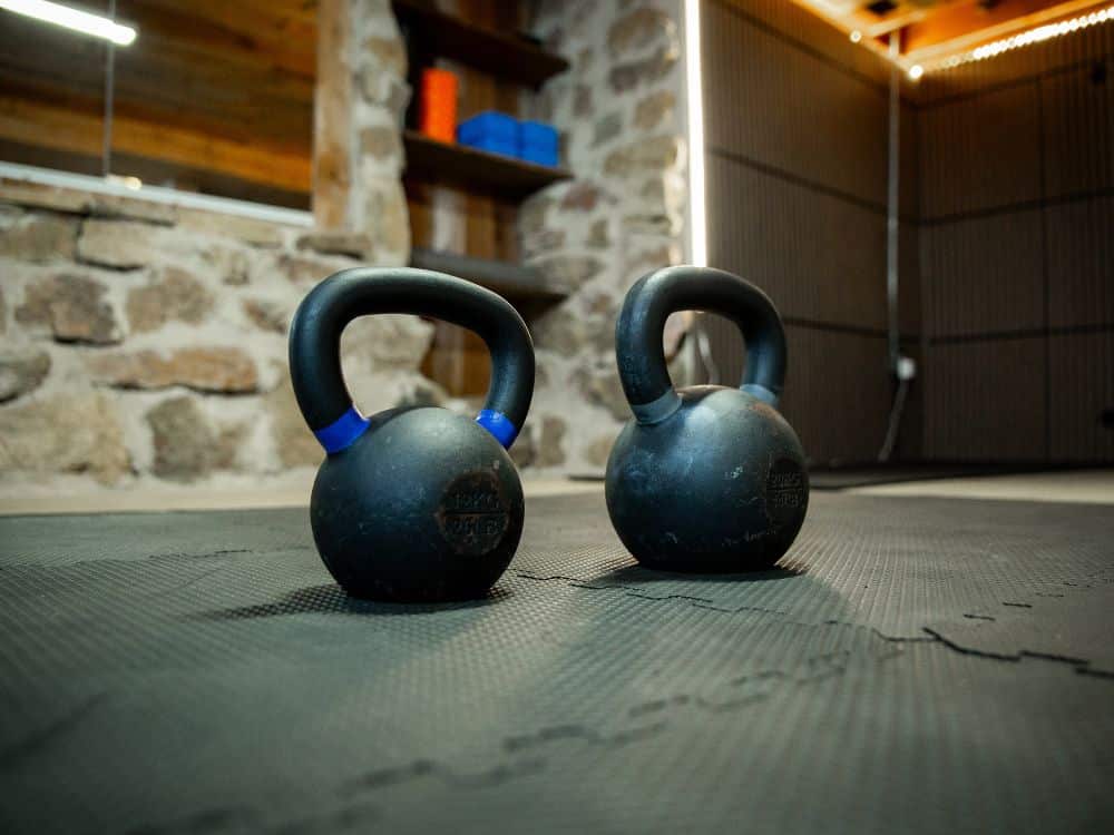 A pair of kettle bells on the floor